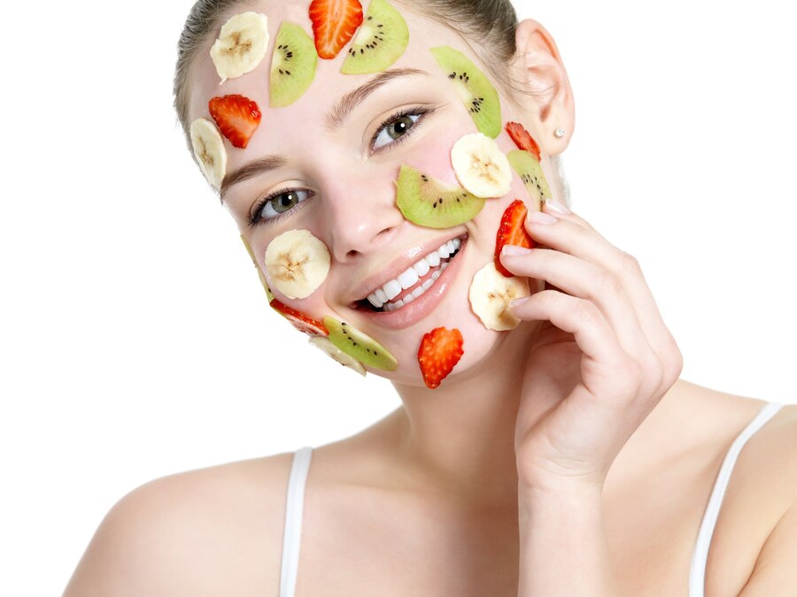 beautiful-young-smiling-cheerful-womanwith-fruit-mask-her-face-isolated-white_186202-1908.jpg